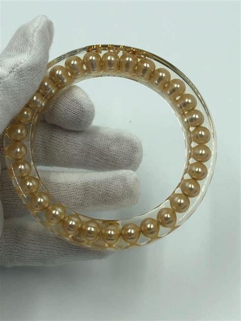 fake lucite chanel bracelet with large pearl|authentic chanel jewelry.